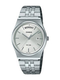 A Casio stainless steel wristwatch with a silver-toned metal link bracelet, a silver dial, and a day-date window displaying 'MONDAY' and '5'.